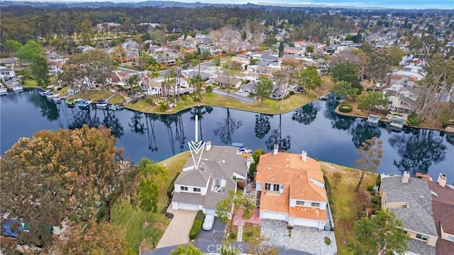 bird's eye view featuring a residential view and a water view