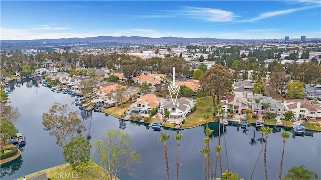 aerial view with a residential view and a water and mountain view