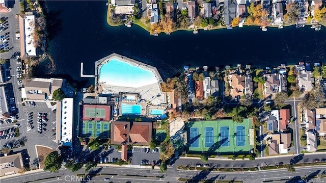 drone / aerial view with a water view and a residential view