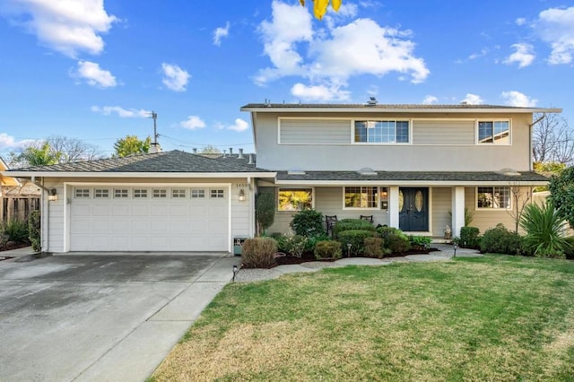 view of front property featuring a garage and a front lawn