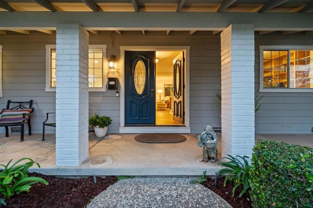 property entrance featuring covered porch