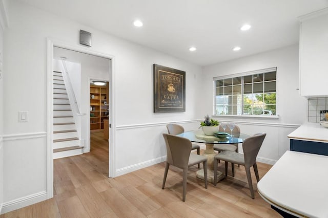 dining space with light hardwood / wood-style flooring