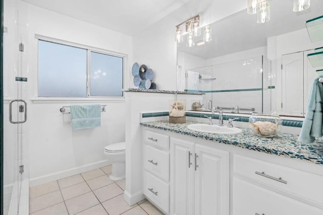 bathroom featuring tile patterned flooring, an enclosed shower, vanity, and toilet