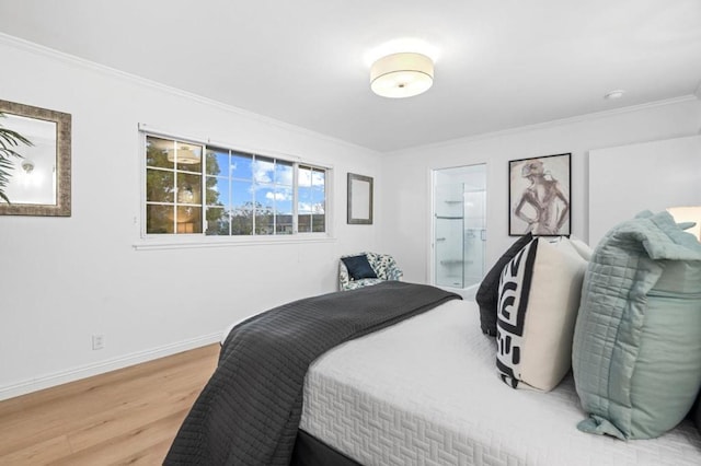 bedroom with ensuite bath, wood-type flooring, and ornamental molding