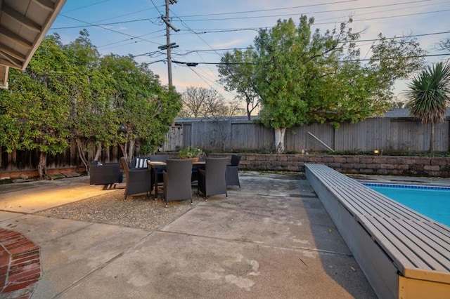 view of patio featuring a fenced in pool