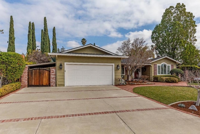 ranch-style house featuring a garage and a front yard