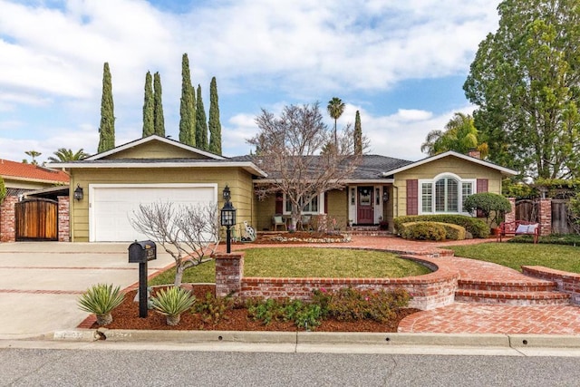 ranch-style house featuring a garage and a front yard