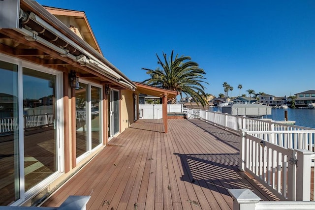 wooden deck with a water view