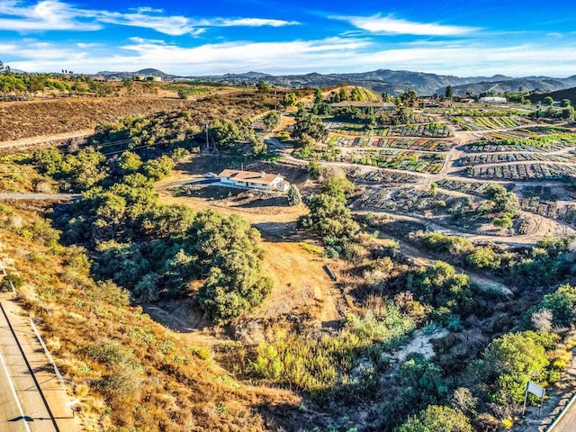 drone / aerial view featuring a mountain view