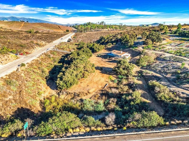 birds eye view of property with a mountain view