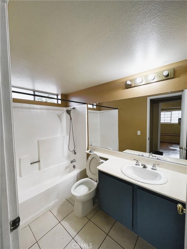 full bathroom with tile patterned floors,  shower combination, vanity, and a textured ceiling