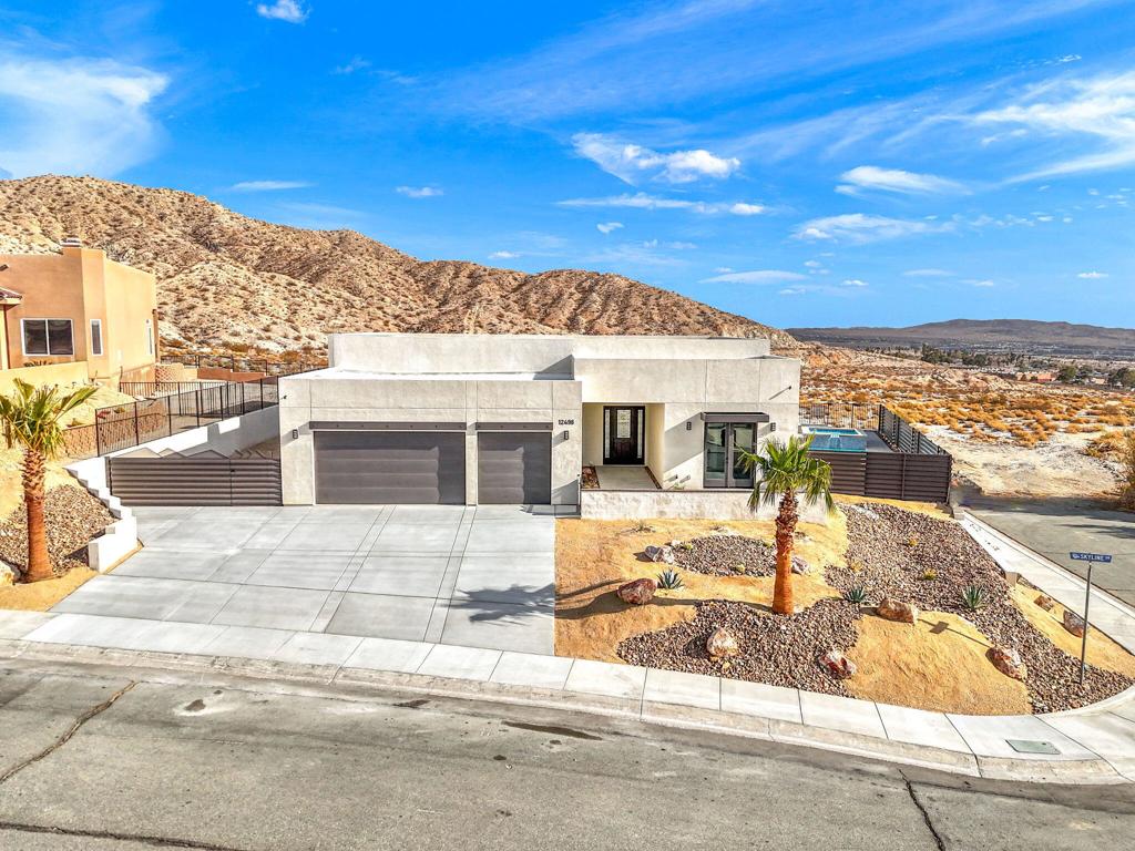 view of front of home featuring a garage and a mountain view