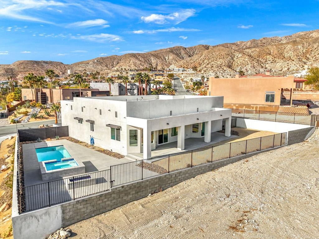 rear view of property with a mountain view