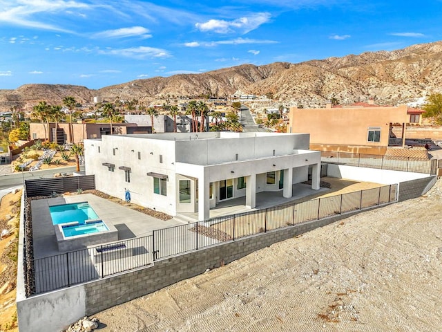 rear view of property with a mountain view