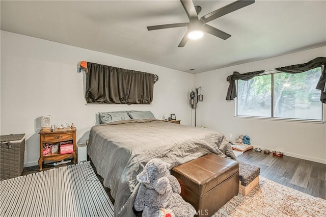 bedroom featuring hardwood / wood-style floors and ceiling fan