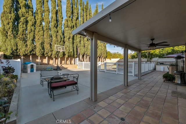 view of patio with ceiling fan and exterior kitchen