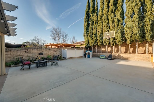 view of patio featuring an outdoor fire pit