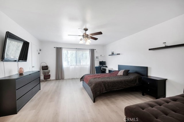 bedroom with ceiling fan and light wood-type flooring