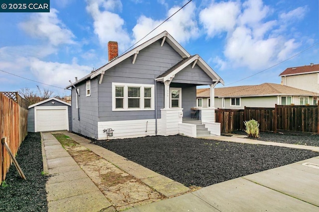 bungalow with an outbuilding and a garage