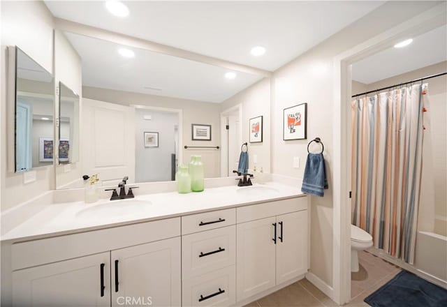 full bathroom with shower / tub combo with curtain, vanity, toilet, and tile patterned flooring