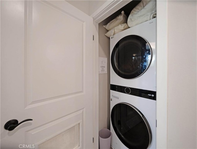 laundry room with stacked washer and clothes dryer