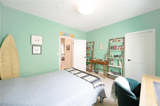 bedroom featuring light colored carpet