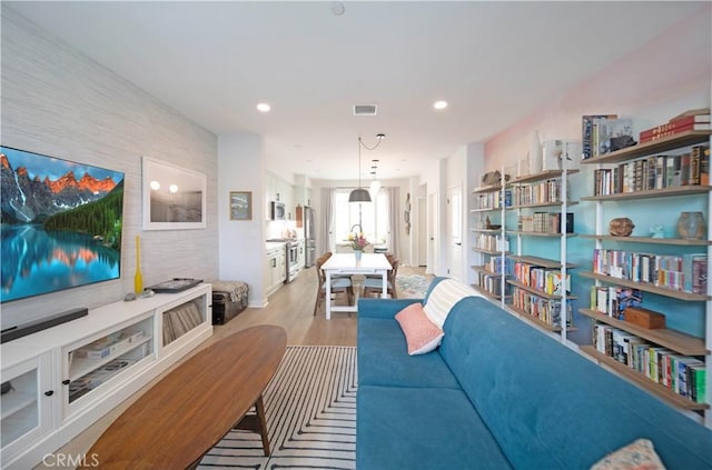 living room with light hardwood / wood-style flooring