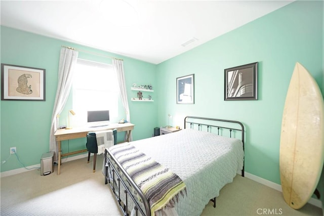 bedroom with light colored carpet