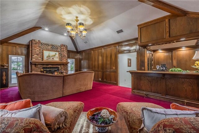 living room featuring carpet, vaulted ceiling with beams, and a brick fireplace