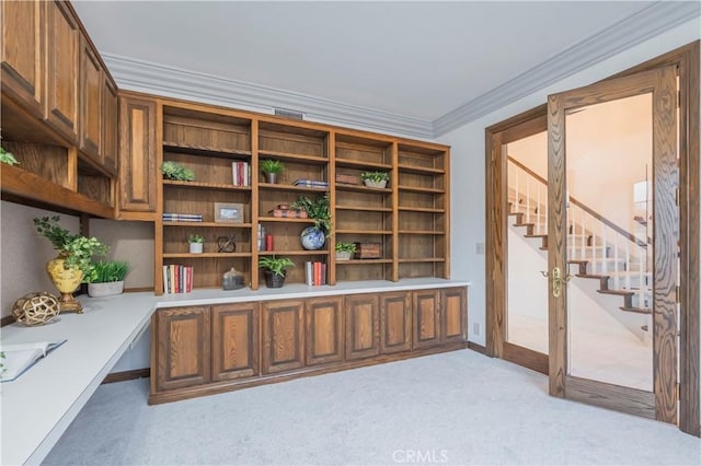 home office with light carpet and crown molding