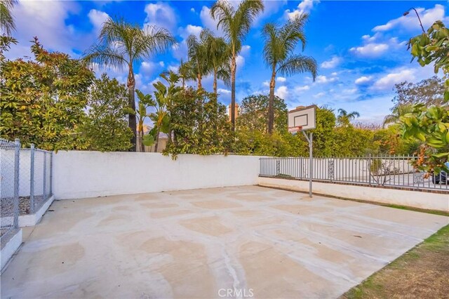 view of patio / terrace with basketball hoop