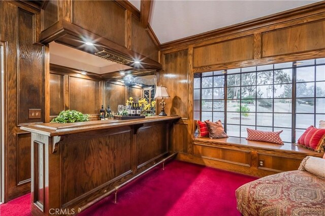 bar with crown molding and wooden walls