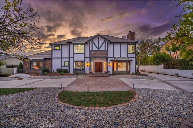 view of back house at dusk