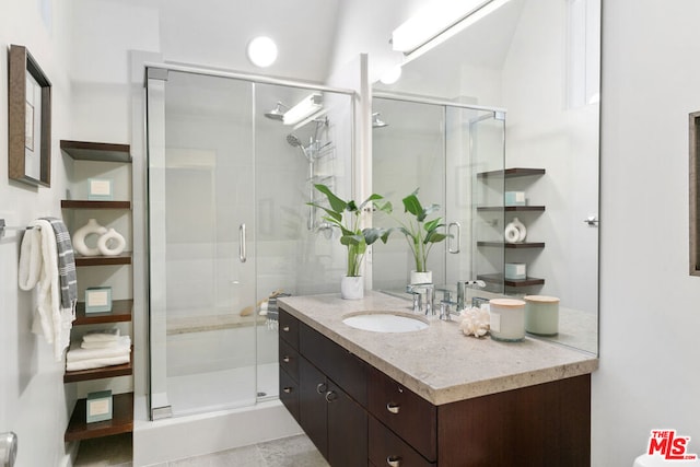 bathroom featuring vanity and walk in shower