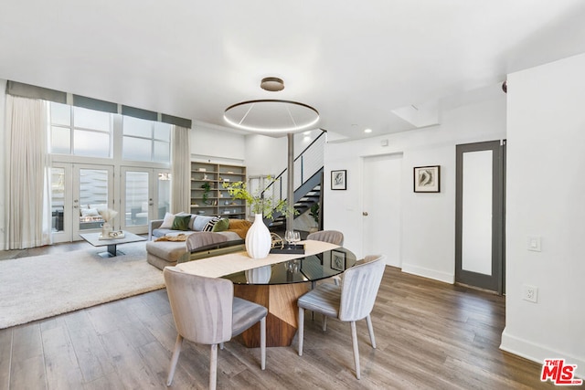 dining space with hardwood / wood-style flooring