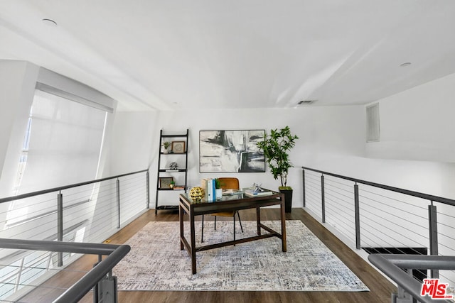 office space with dark hardwood / wood-style flooring