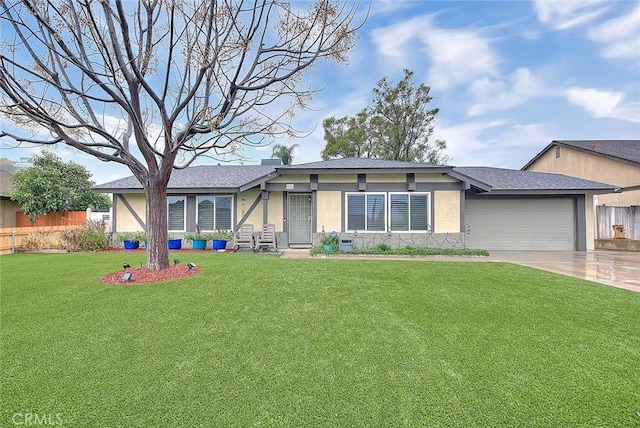 view of front facade with a garage and a front lawn