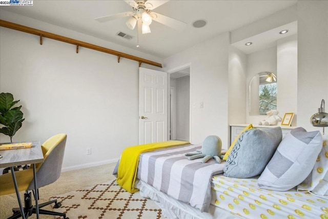 bedroom featuring light carpet and ceiling fan