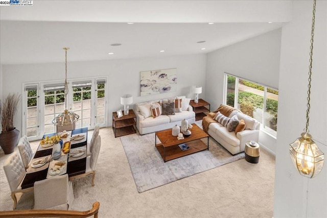 carpeted living room featuring vaulted ceiling