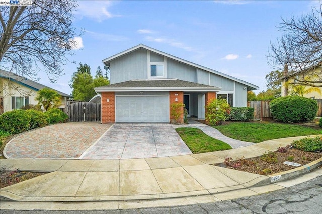 view of front facade with a garage and a front lawn