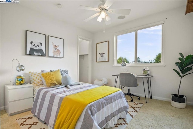 bedroom featuring light colored carpet and ceiling fan