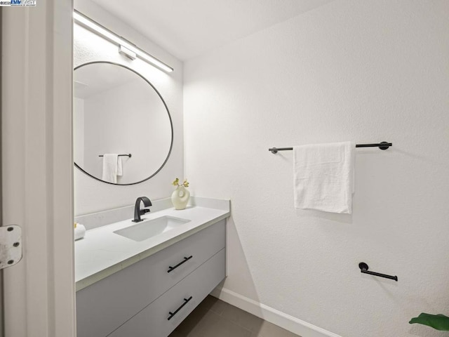 bathroom with vanity and tile patterned flooring