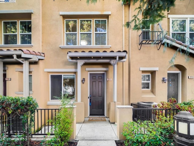 doorway to property featuring central AC