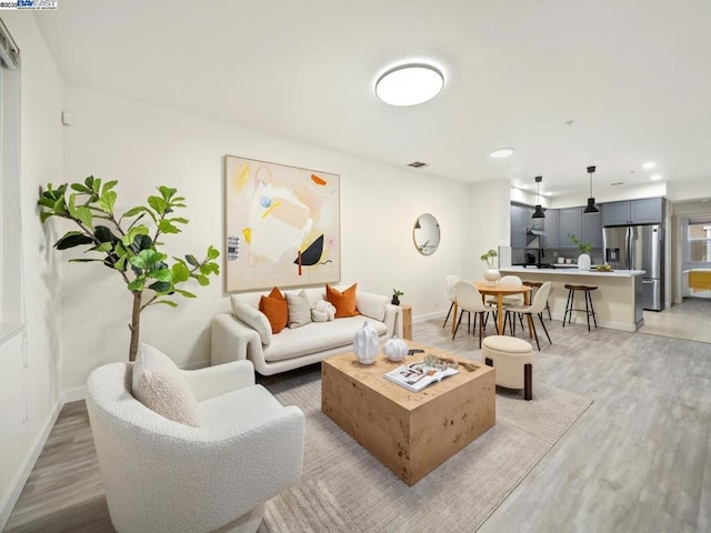 living room with light hardwood / wood-style floors