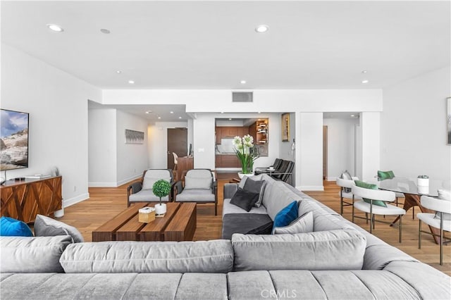 living room with light hardwood / wood-style floors