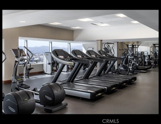 exercise room with a mountain view