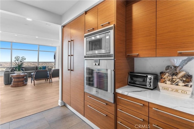 kitchen featuring light tile patterned flooring and appliances with stainless steel finishes