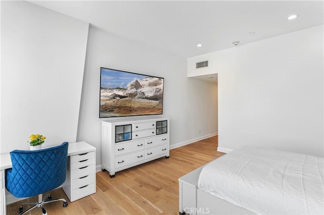 bedroom featuring light hardwood / wood-style floors