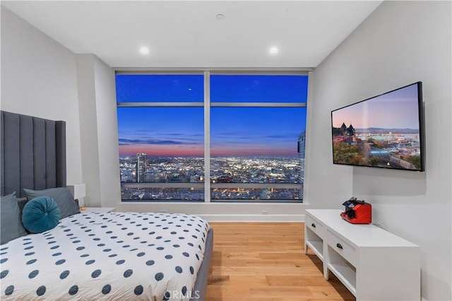 bedroom with light hardwood / wood-style floors