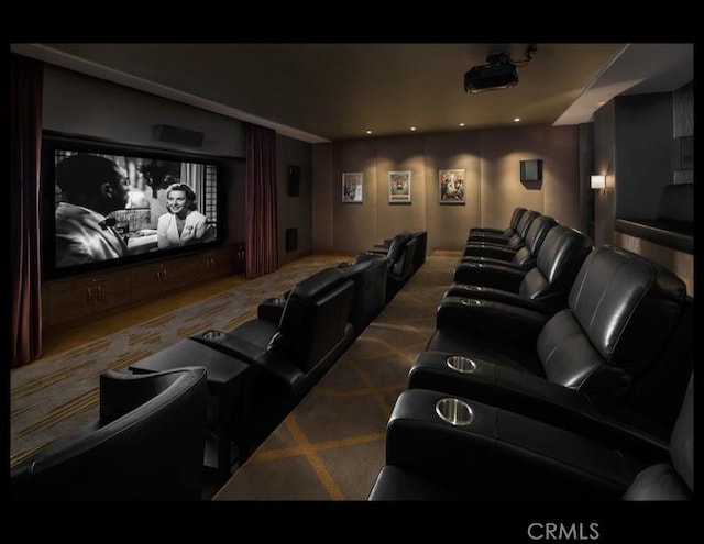 carpeted cinema room with recessed lighting